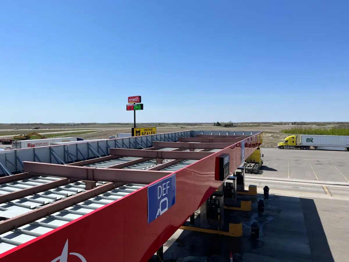 Aerial view of a distribution terminal with trailers lined up along a controlled entrance