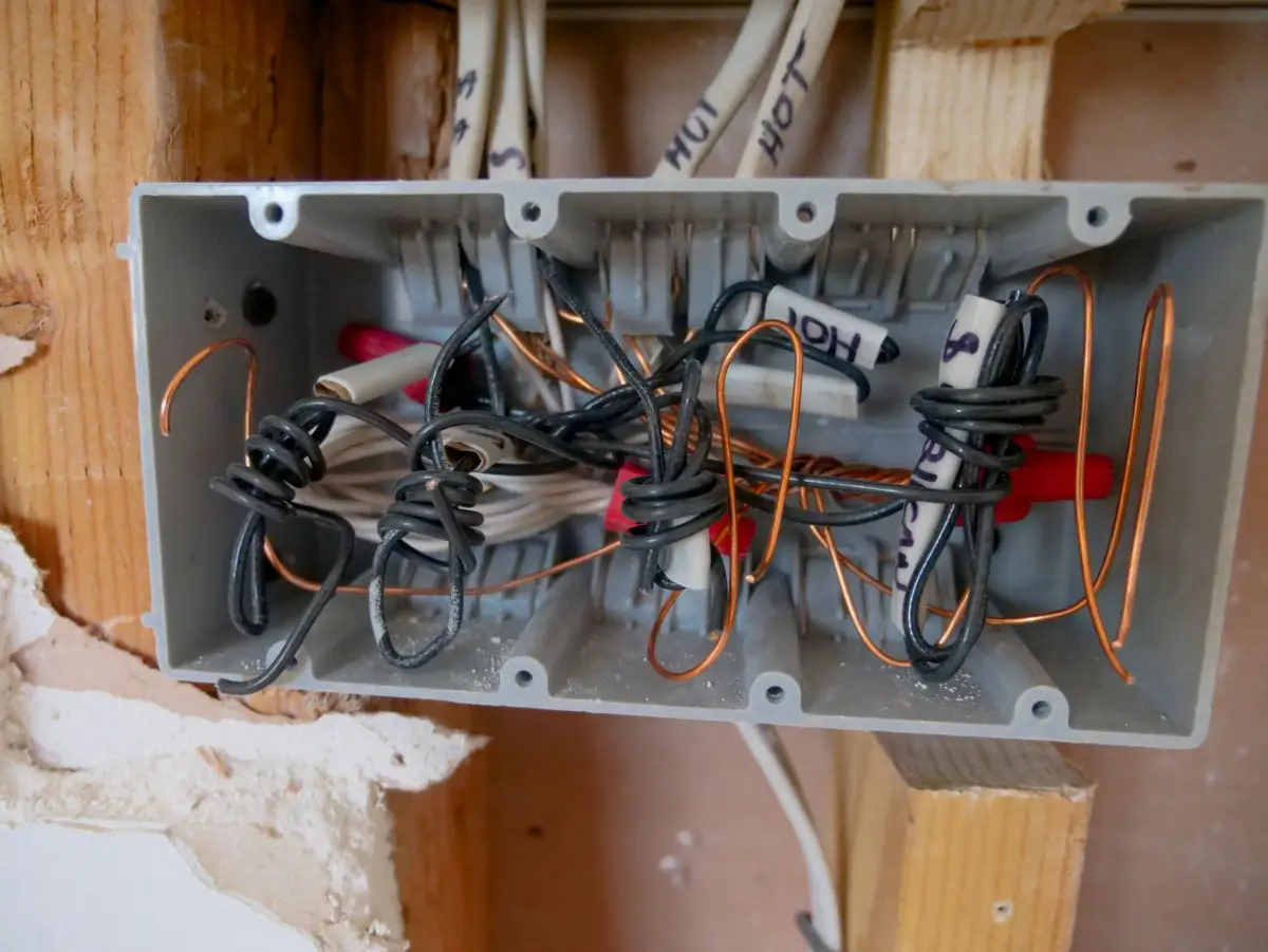 Open junction box with low-voltage wiring terminations for a gate operator control circuit